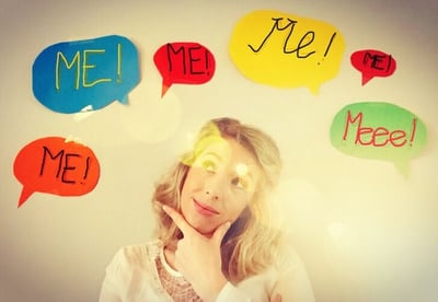 Girl looks up with thought bubbles around her head